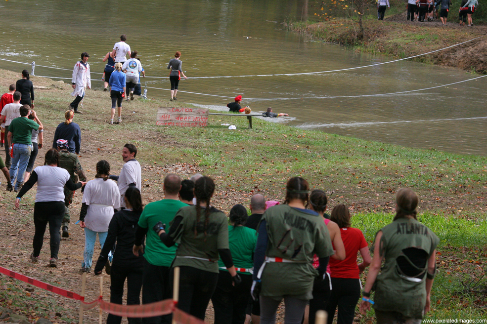 Runners entering the water obstacle in Run For Your Lives 2011