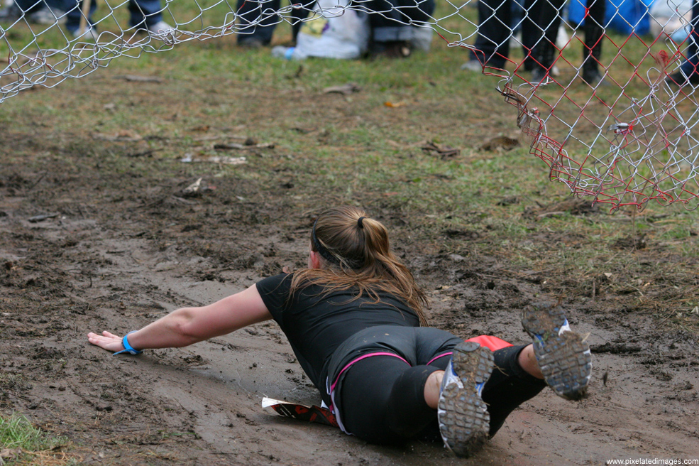Sliding under a fence at the finish line of Run For Your Lives 2011